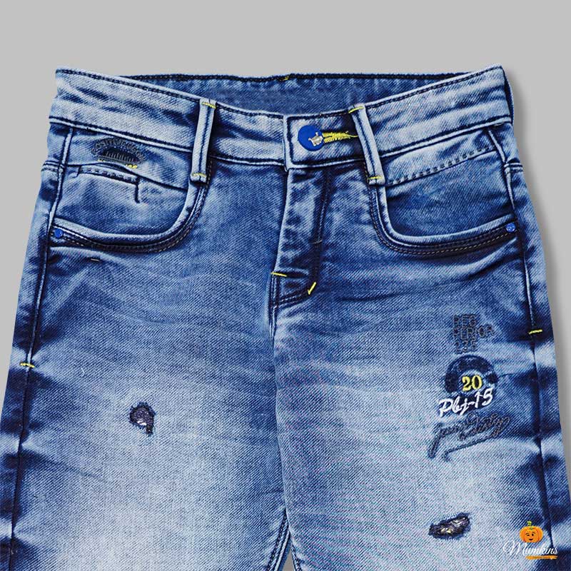 Dark Blue Ripped Pattern Boys Jeans Close Up 